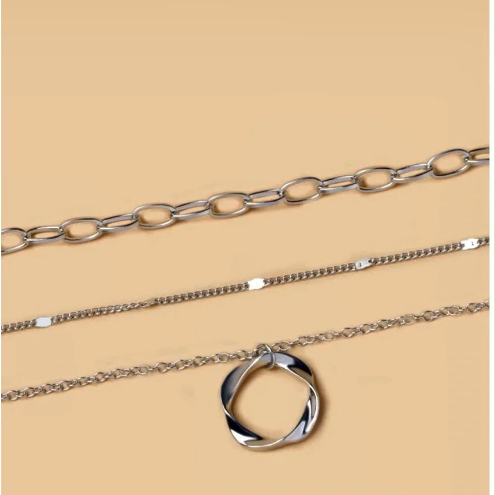 Geometric round charm layered necklace. - Picture 2 of 3